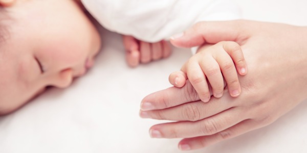 Why do babies startle in their sleep and How can you help them?